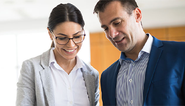 Two people talking in a work setting