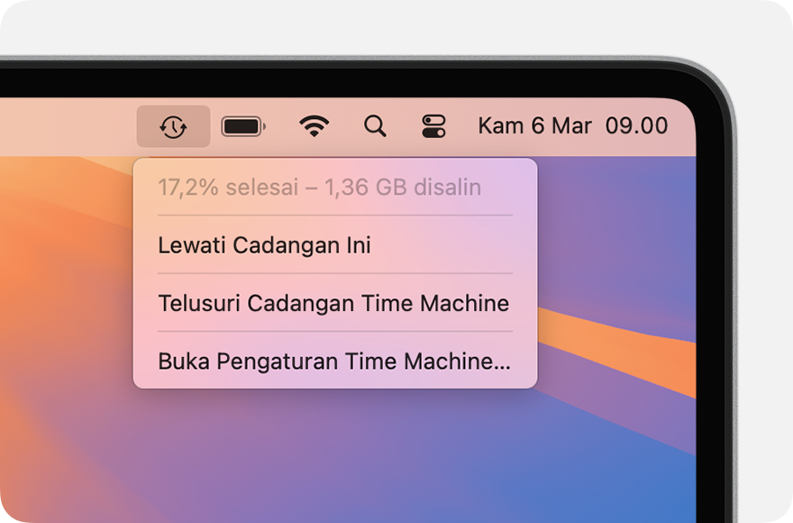 Menu Time Machine menampilkan pencadangan yang sedang berlangsung.