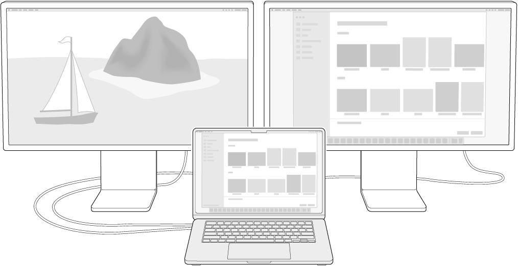 A MacBook Air next to two Studio Displays used as external displays.
