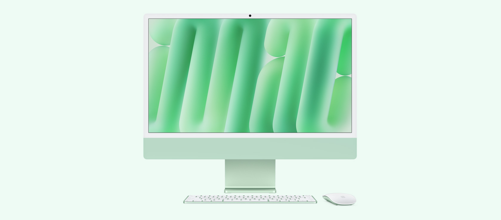 لقطة أمامية لجهاز iMac باللون الأخضر مع ماوس ولوحة مفاتيح بلون يطابق لون الجهاز