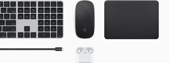 Collection of accessories including Magic Keyboard, Magic Mouse, Magic Trackpad, Thunderbolt 4 Pro cable and AirPods Pro.