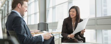 Husband and wife talk to their Merrill financial advisor Husband and wife talk to their Merrill financial advisor